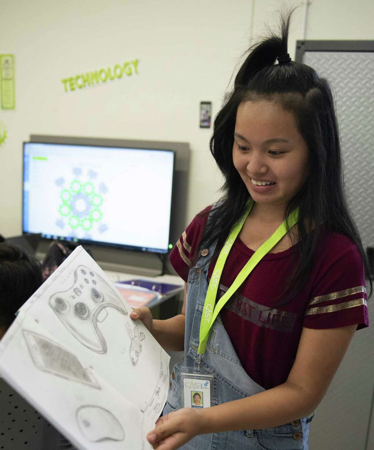 Yoube Htoo, 15, a freshman at CAST STEM, shows her engineering sketches during class on Thursday, September 6, 2018.
