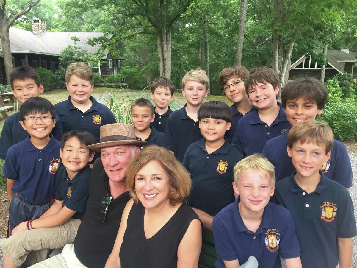 David Pittsinger (in hat) with wife Patricia Schuman and members of the Trinity Men & Boys Choir.