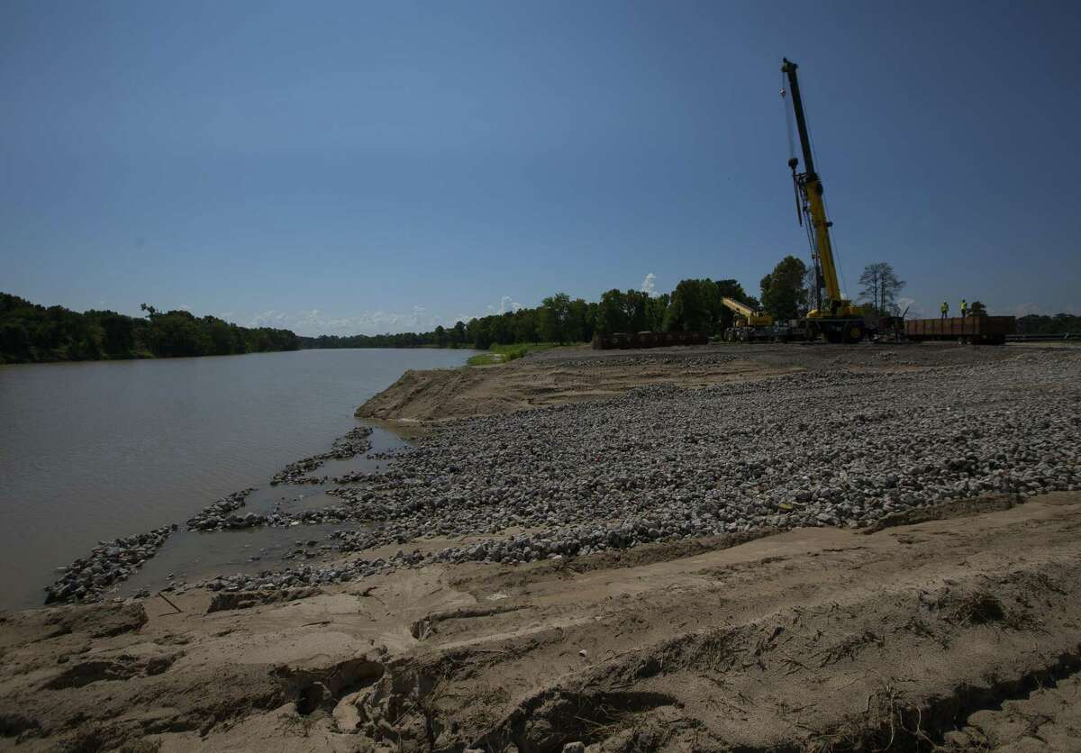 A ramp is built as contractors stage equipment for the Army Corps of Engineers' planned dredging of the West Fork of the San Jacinto River east of U.S. 59.
