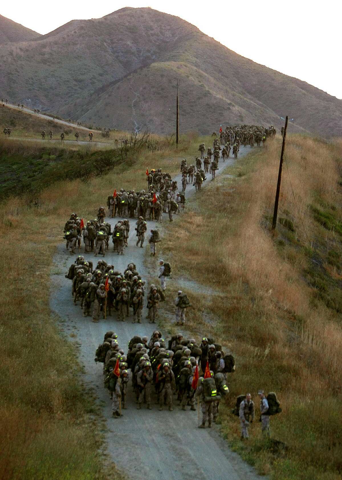 The Marine platoon regroups on top of the summit during the Reaper Hike, seperating into individual squars for the hike back to camp., at Camp Pendleton, Calif. Photo by Michael Macor/ San Francisco Chronicle