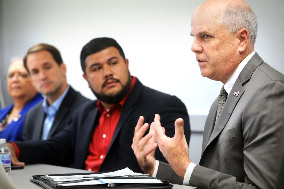 Richard Branigan, right, Chief Administrative Office for the Red Cross of Connecticut and Rhode Island, speaks at a public forum updating federal, state and local relief efforts one year after Hurricane Maria devasted Puerto Rico, in Bridgeport, Conn. Sept. 20, 2018. Branigan is seen here with State Rep. Christopher Rosario, center, and Congressman Jim Himes, left.