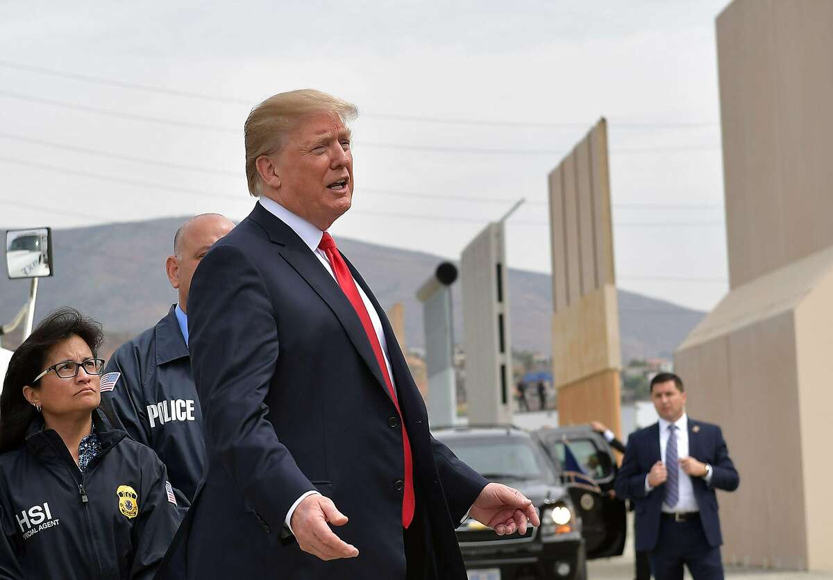 In this file photo taken on March 13, 2018 US President Donald Trump inspects border wall prototypes in San Diego.