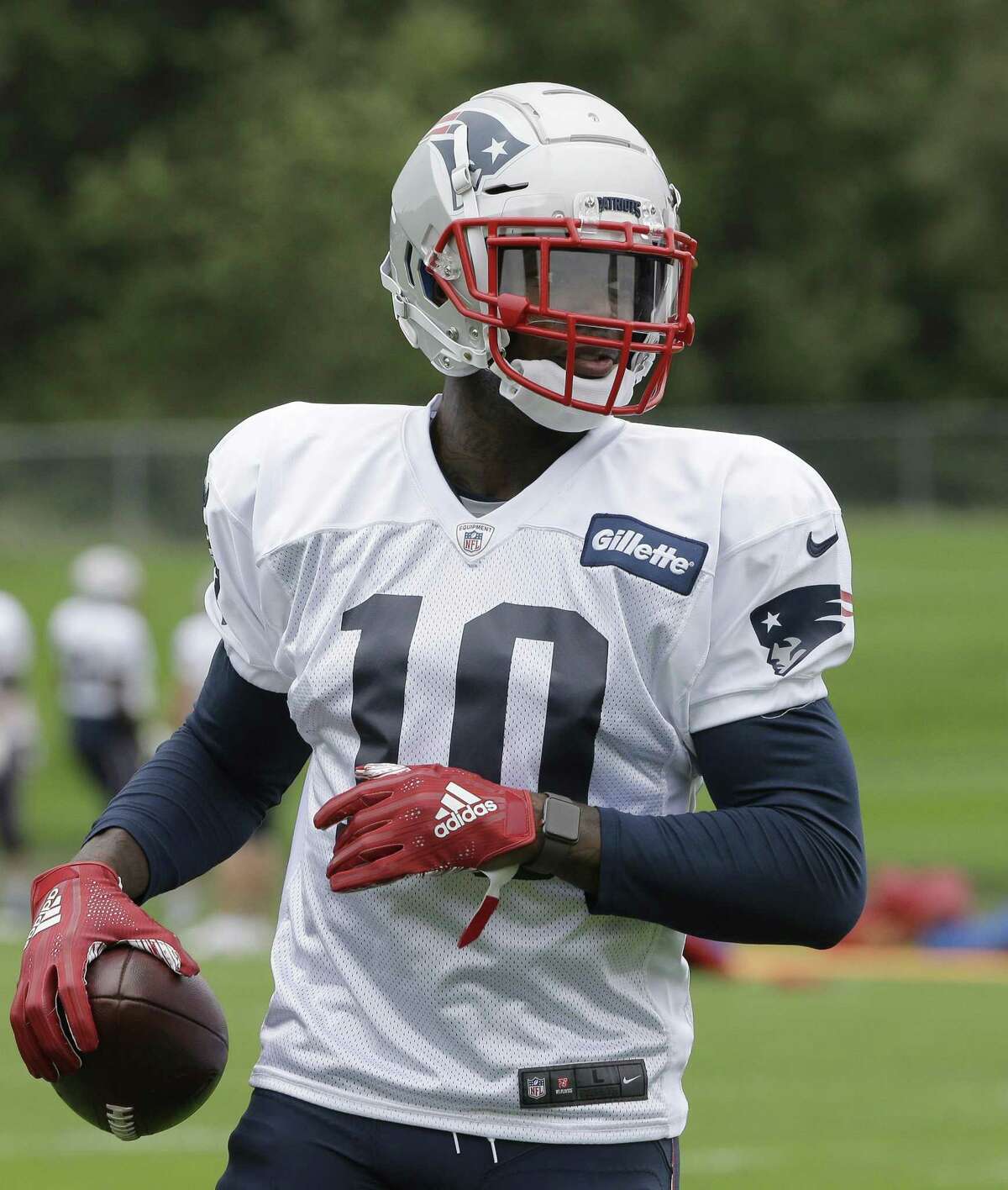 New England Patriots wide receiver Josh Gordon holds the ball during an NFL football practice, Wednesday, Sept. 19, 2018, in Foxborough, Mass. (AP Photo/Steven Senne)