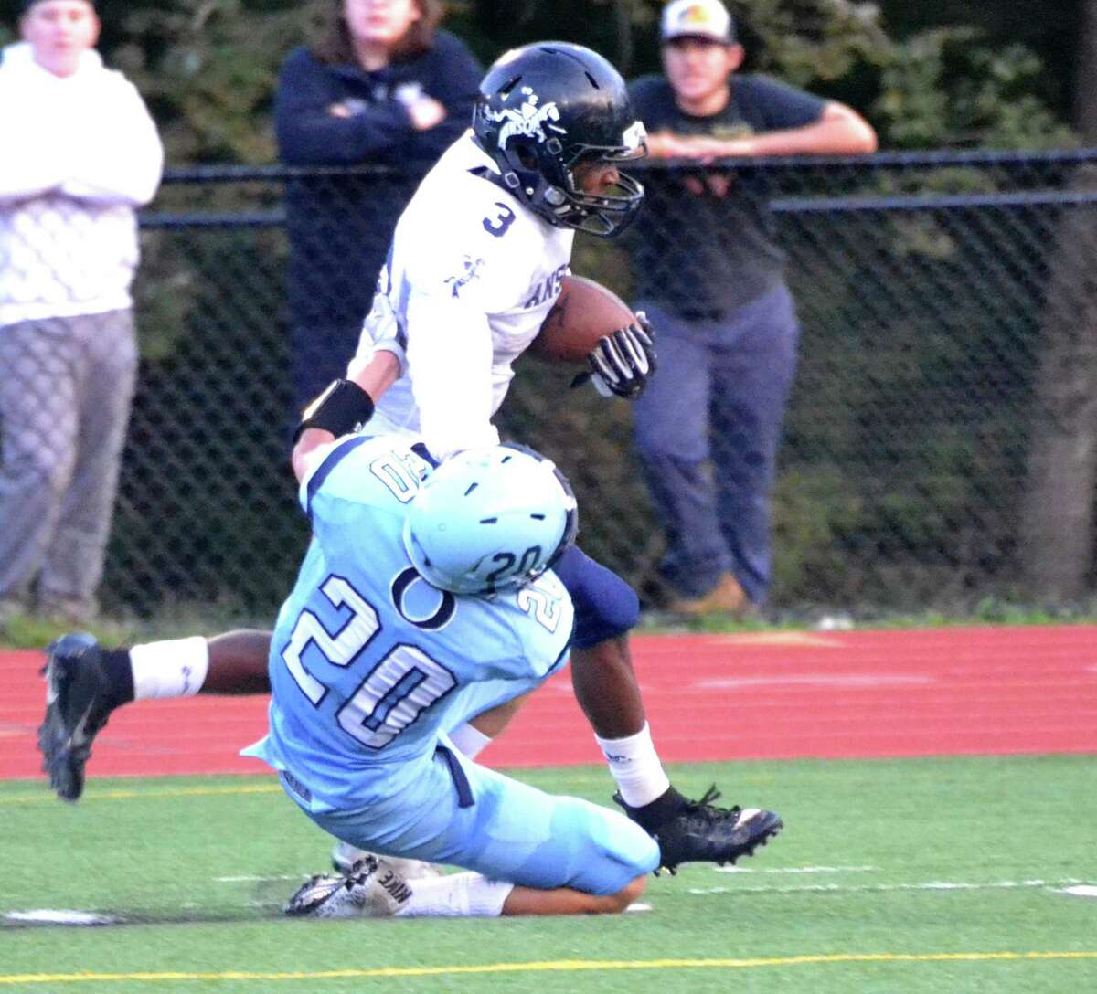 Ansonia’s Shykeem Harmon stiff arms an Oxford defender on his way to the end zone on Thursday.