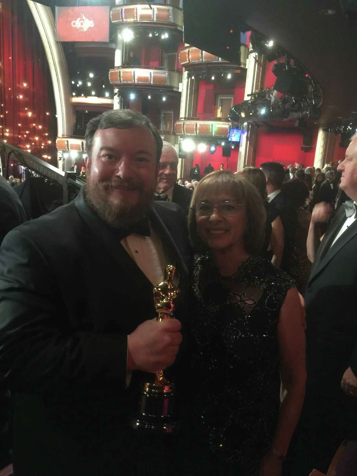 Thomas Curley with his mother, Sandra, and his sound-mixing Oscar at the Academy Awards in 2015. (Photo courtesy Thomas Curley)