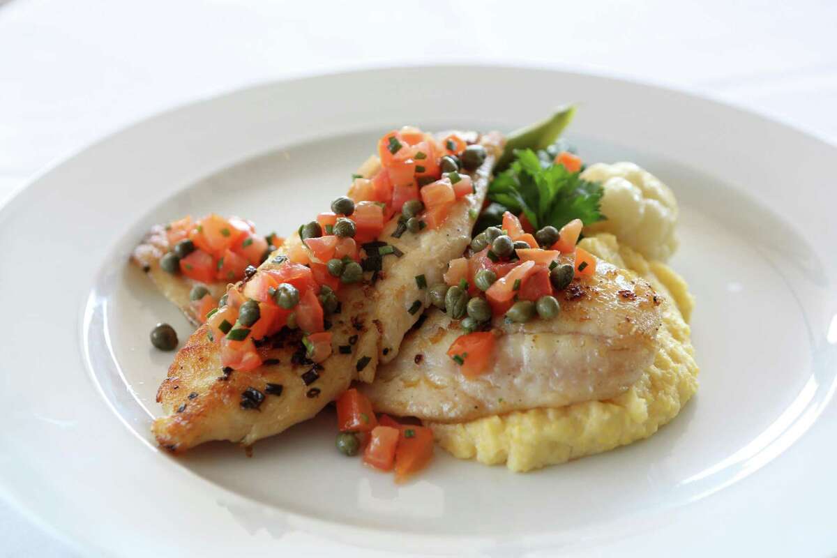 Texas flounder with citrus mashed potatoes, broccolini and diced tomatoes with capers at Amalfi Ristorante Italiano & Bar