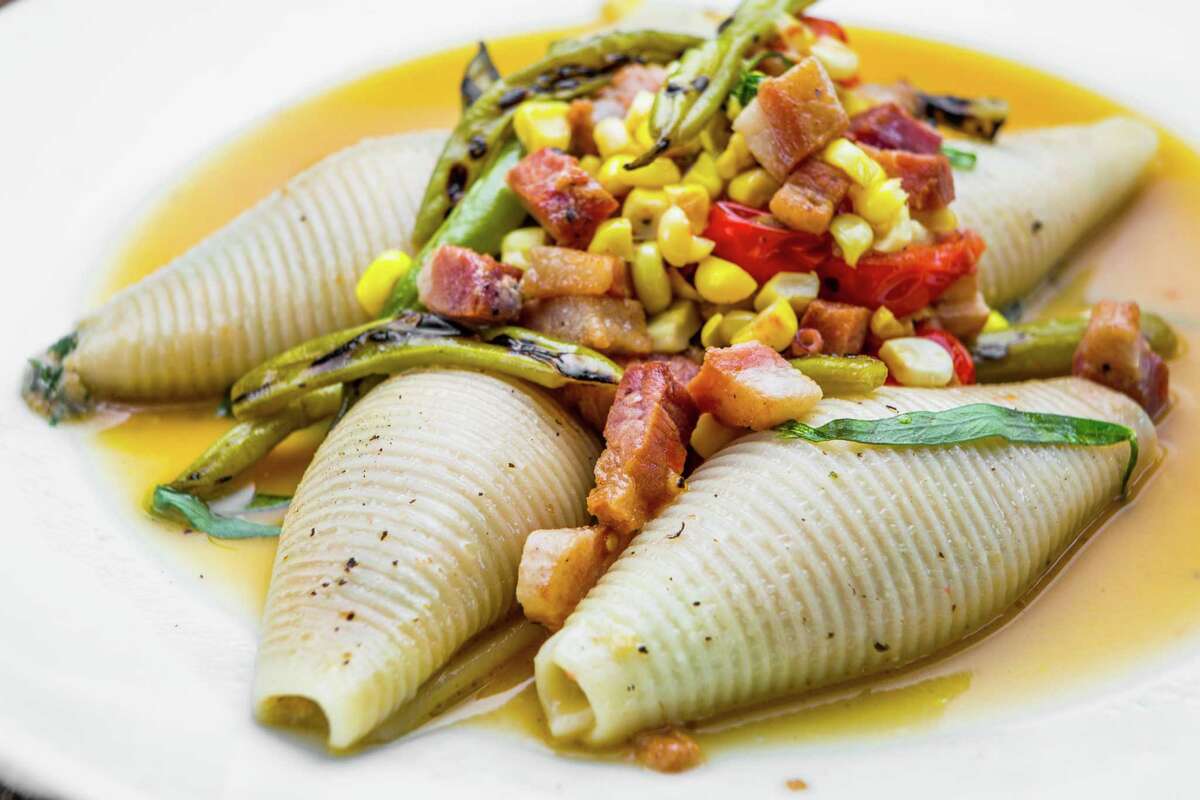 Ricotta-stuffed shell pasta with corn, pancetta and blistered green beans at Coltivare
