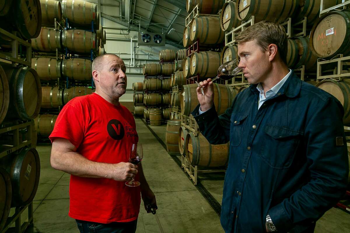 Jamie Watson of D. Wade cellars talks with his winemaker John Keyes about the wine the Cabernet in the barrel at their custom crush facility in Sonoma, Calif. on Sept. 20th, 2018.