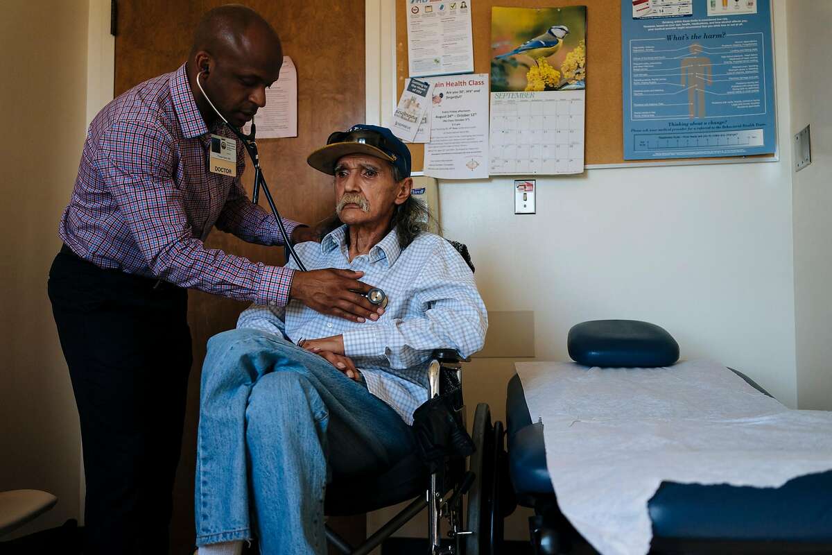 HIV health care provider, Hyman Scott, MD, checks the breathing of his patient, Richard Ramirez, 67, during a check up at the San Francisco General Hospital's Division of HIV/AIDS, Ward 86 in San Francisco, Calif., on Thursday, Sept. 20, 2018.