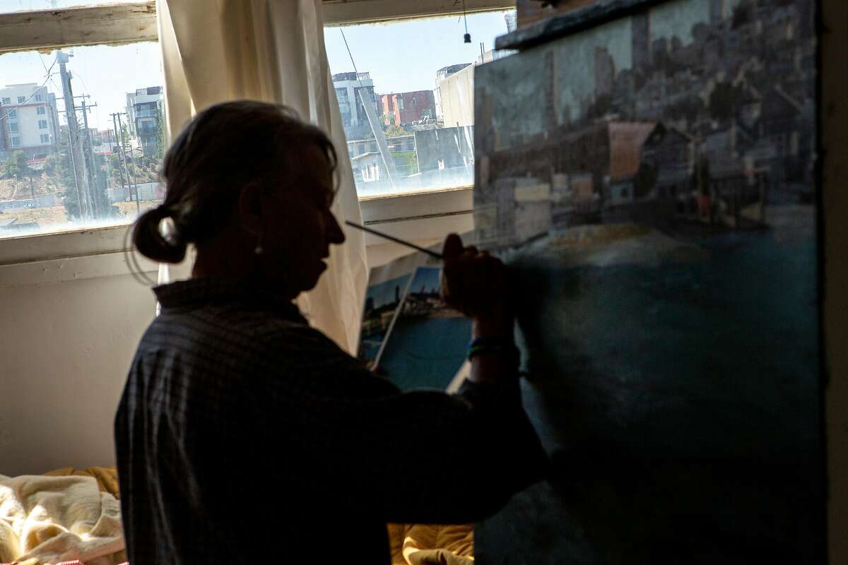 Eileen David paints at Building 125 at the Hunters Point Shipyard, Friday, Sept. 21, 2018, in San Francisco, Calif. A radioactive deck marker was found on Parcel A near Donahue Street and Galvez Avenue at the former Hunters Point Naval Shipyard. David is an artist working out of building 125 on Parcel B. She's been nurturing the cats near the site of the marker for the last three years.