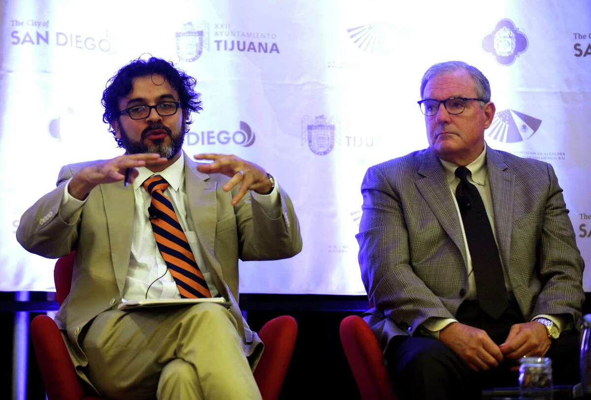 Sergio Silva, left, economic adviser to incoming Mexican President Andrés Manuel López Obrador, discusses trade at the Border Mayors Association Summit on Friday.
