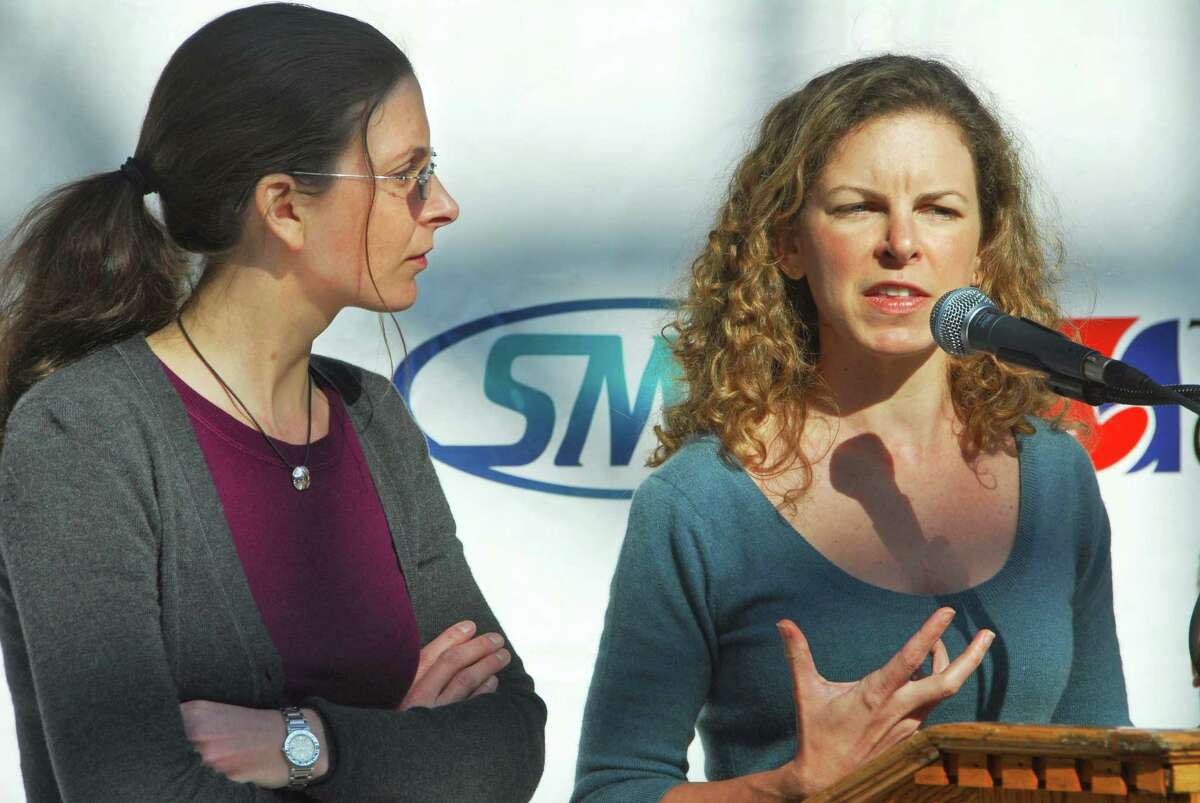 Clare Bronfman, left, and sister Sara Bronfman discuss the schedule of events for the Dalai Lama's upcoming visit to Albany at a news conference Tuesday morning March 17, 2009, at the Times Union Center. (John Carl D'Annibale / Times Union)