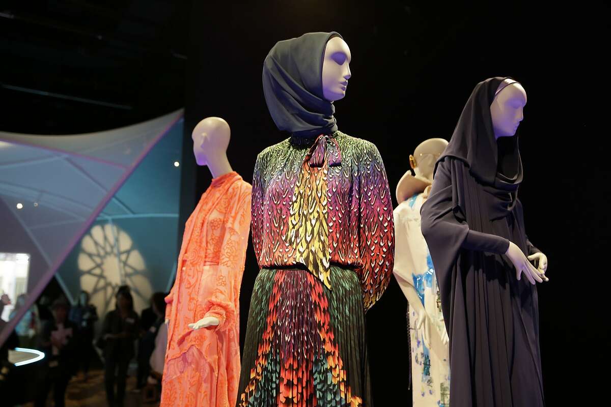 In this photo taken Thursday, Sept. 20, 2018, is the exhibit Contemporary Muslim Fashions at the M. H. de Young Memorial Museum in San Francisco. The first major museum exhibition of contemporary Muslim women's fashion reflects designs from around the world that are vibrant and elegant, playful and diverse. (AP Photo/Eric Risberg)