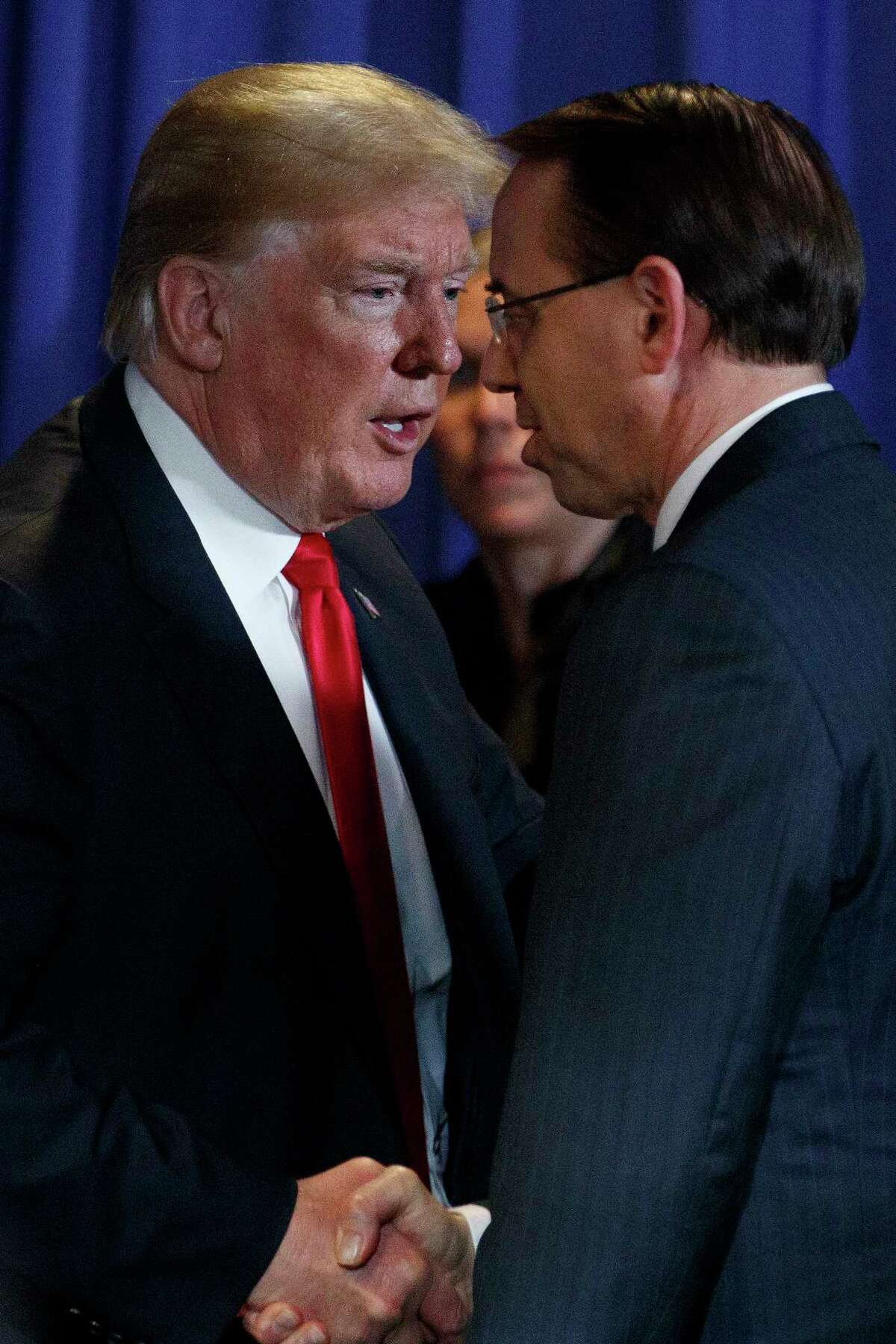 FILE -- President Donald Trump speaks with Rod Rosenstein, the deputy attorney general, at a forum on immigration policy and gangs in Bethpage, N.Y., on May 23, 2018. (Tom Brenner/The New York Times)