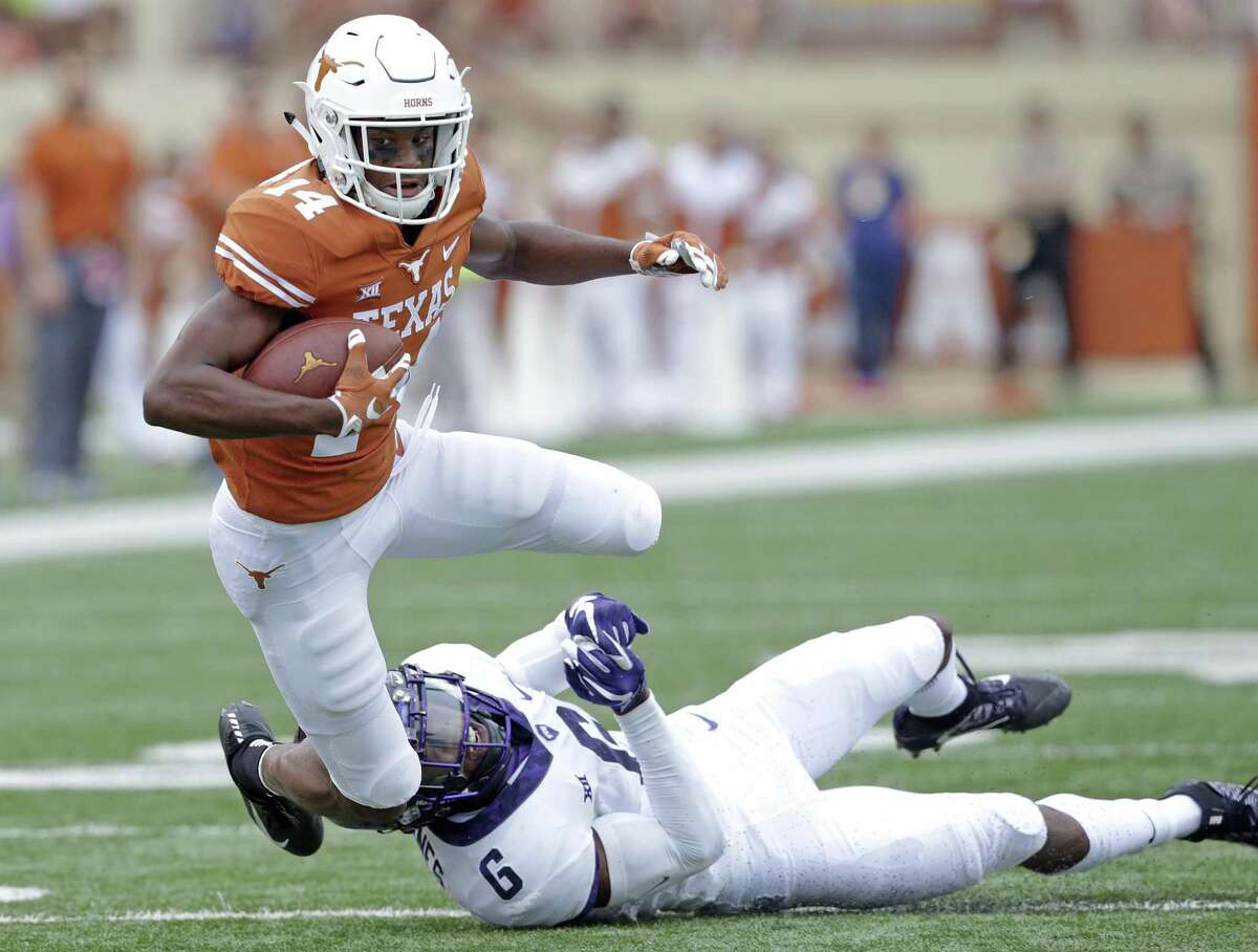 Longhorn receiver Joshua Moore pops away from Innis Gaines after a catch as UT hosts TCU at DKR Stadium on September 22, 2018.