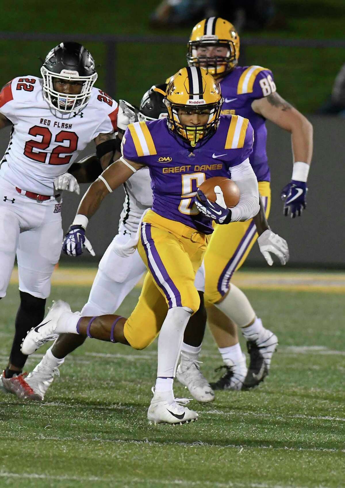 University at Albany wide receiver Dev Holmes runs with the ball against St. Francis in 2018. Holmes will play with New Haven this season.