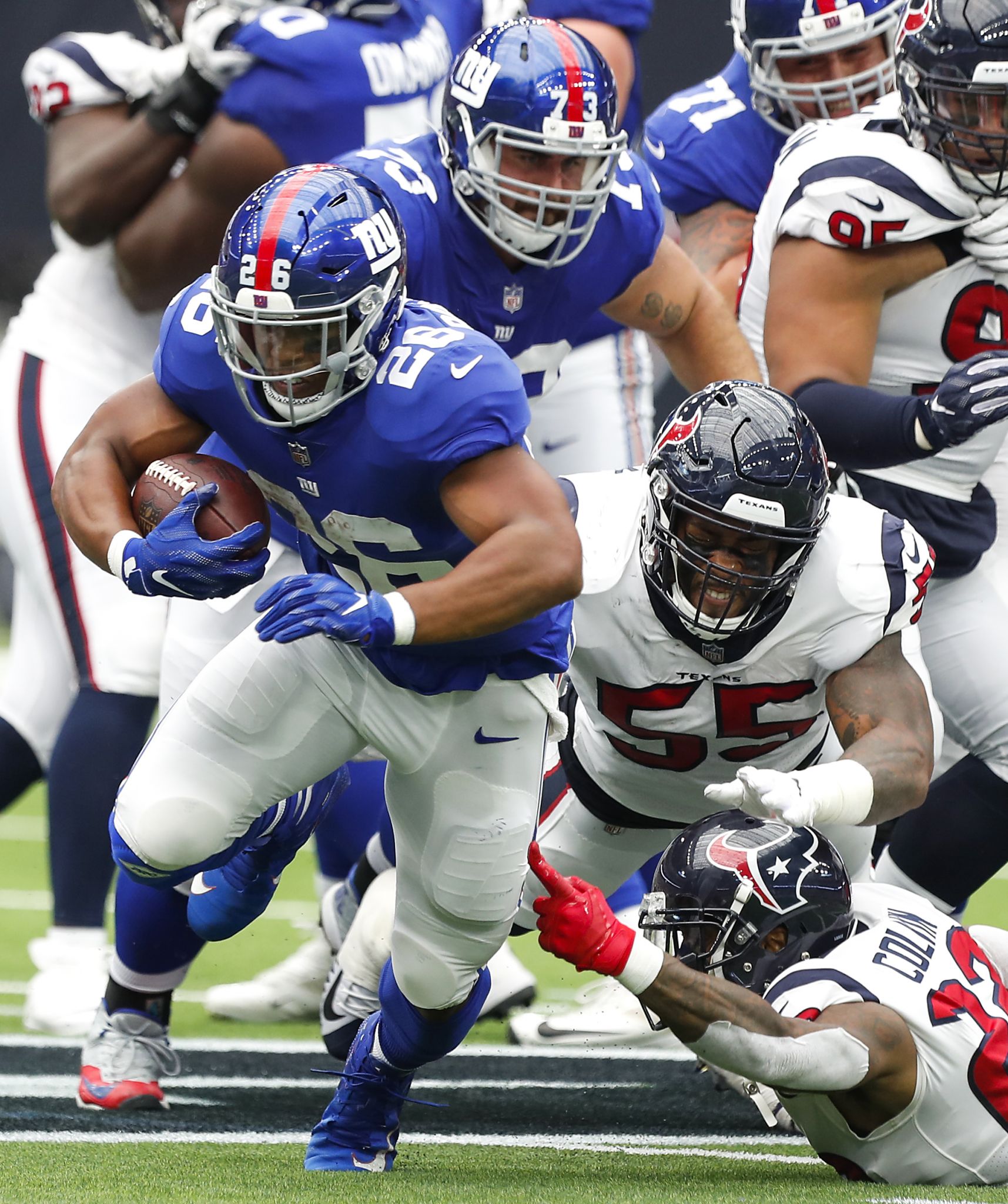 Houston Texans quarterback Deshaun Watson (4) breaks away from New York  Giants defensive end Kerry Wynn (72) during the first half of an NFL  football game Sunday, Sept. 23, 2018, in Houston. (