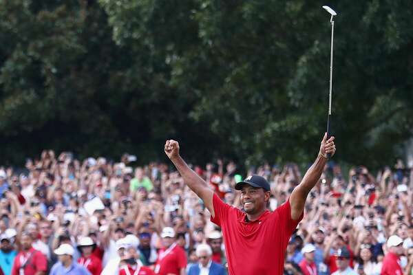 ATLANTA, GA - SEPTEMBER 23: Tiger Woods of the United States celebrates making a par on the 18th green to win the TOUR Championship at East Lake Golf Club on September 23, 2018 in Atlanta, Georgia. (Photo by Tim Bradbury/Getty Images)