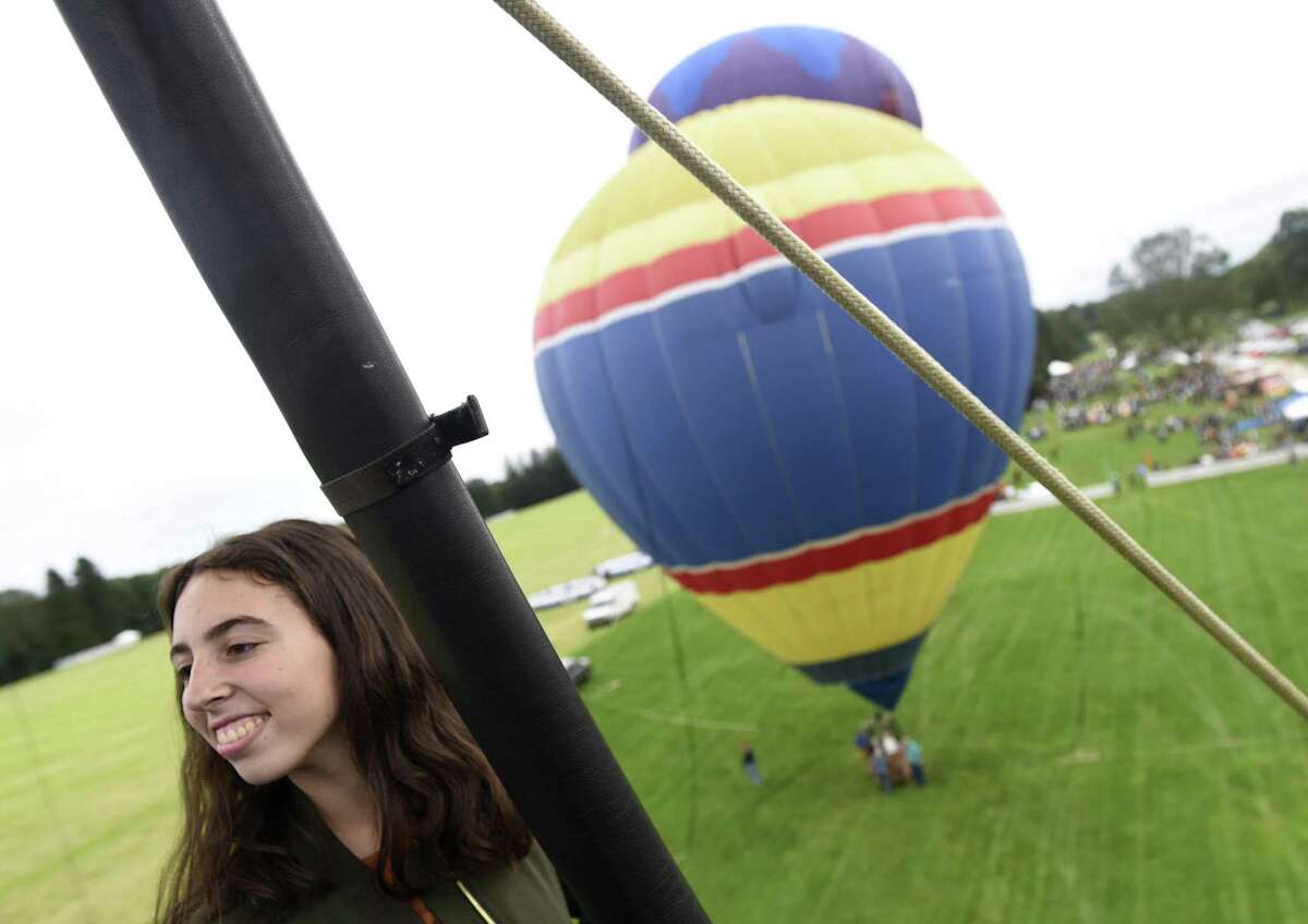 Greenwich's Abigail Kay, 14, looks out from a hot air balloon at the Greenwich Land Trust's 19th annual Go Wild! Family Field Day at the Greenwich Polo Club in Greenwich, Conn. Sunday, Sept. 23, 2018. The event featured a variety of fun outdoor activities including hot air balloon rides, bungee trampolines, a climbing wall, pick up soccer games and more, as well as a selection of food trucks. The event supports GLT's ongoing land stewardship efforts and general operational costs.