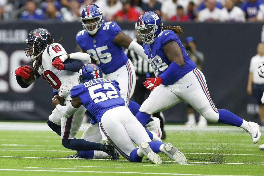 Houston Texans wide receiver DeAndre Hopkins (10) is tackled by New York Giants linebacker Alec Ogletree (52) during the first half as the Houston Texans take on the New York Giants at NRG Stadium Sunday Sept. 23, 2018 in Houston. Photo: Michael Ciaglo, Houston Chronicle / Staff Photographer / Michael Ciaglo