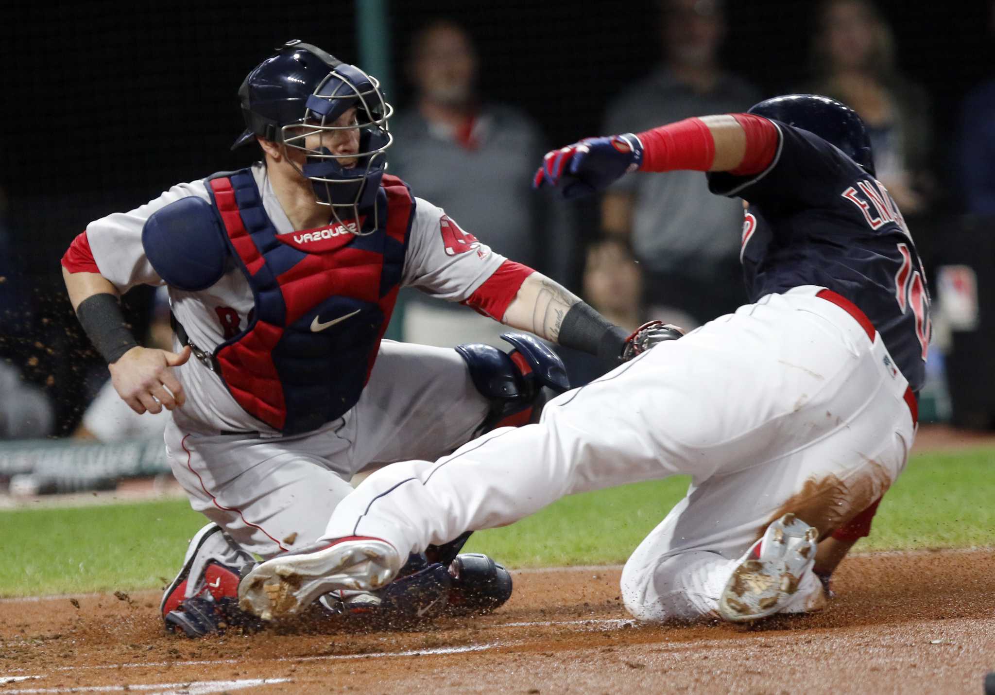 Houston Astros' Michael Brantley is out at first by Boston Red Sox first  baseman Kyle Schwarber during the seventh inning in Game 2 of baseball's  American League Championship Series Saturday, Oct. 16