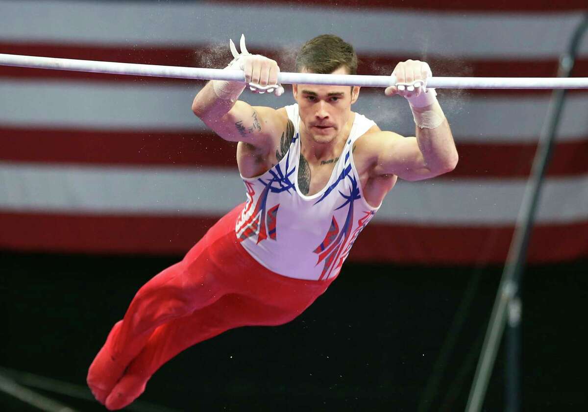 Colin Van Wicklen competes on the high bar at the U.S. Gymnastics Championships, Thursday, Aug. 16, 2018, in Boston. (AP Photo/Elise Amendola)