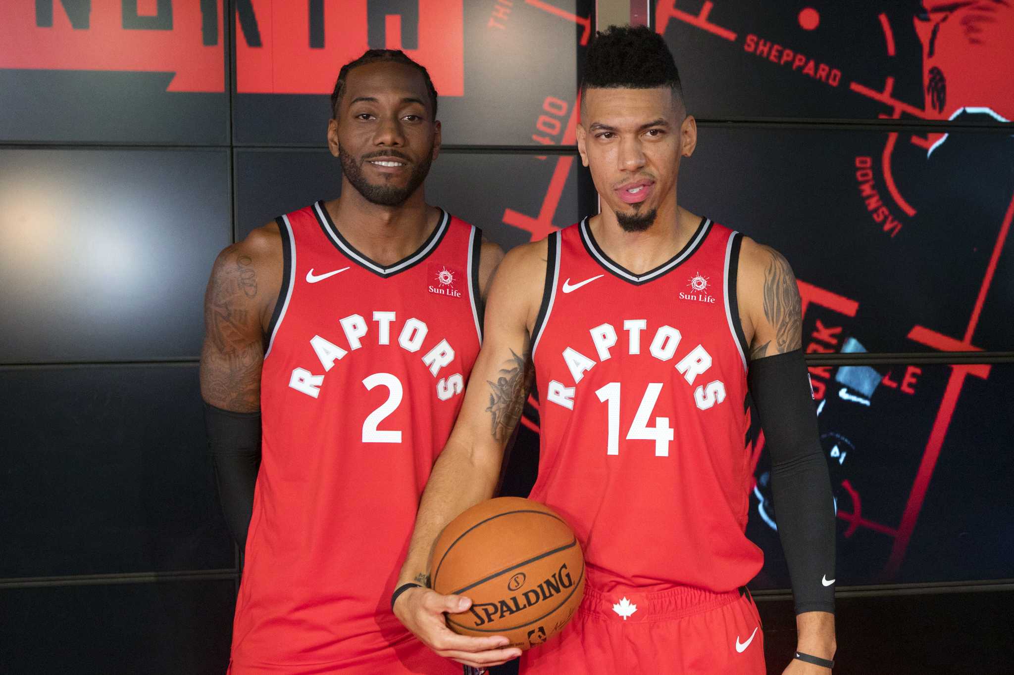 NBA jerseys for newly-acquired Toronto Raptors player Kawhi Leonard hang in  the Real Sports Apparel store at Scotiabank Arena in in Toronto, Friday  July 20, 2018. (Mark Blinch/The Canadian Press via AP