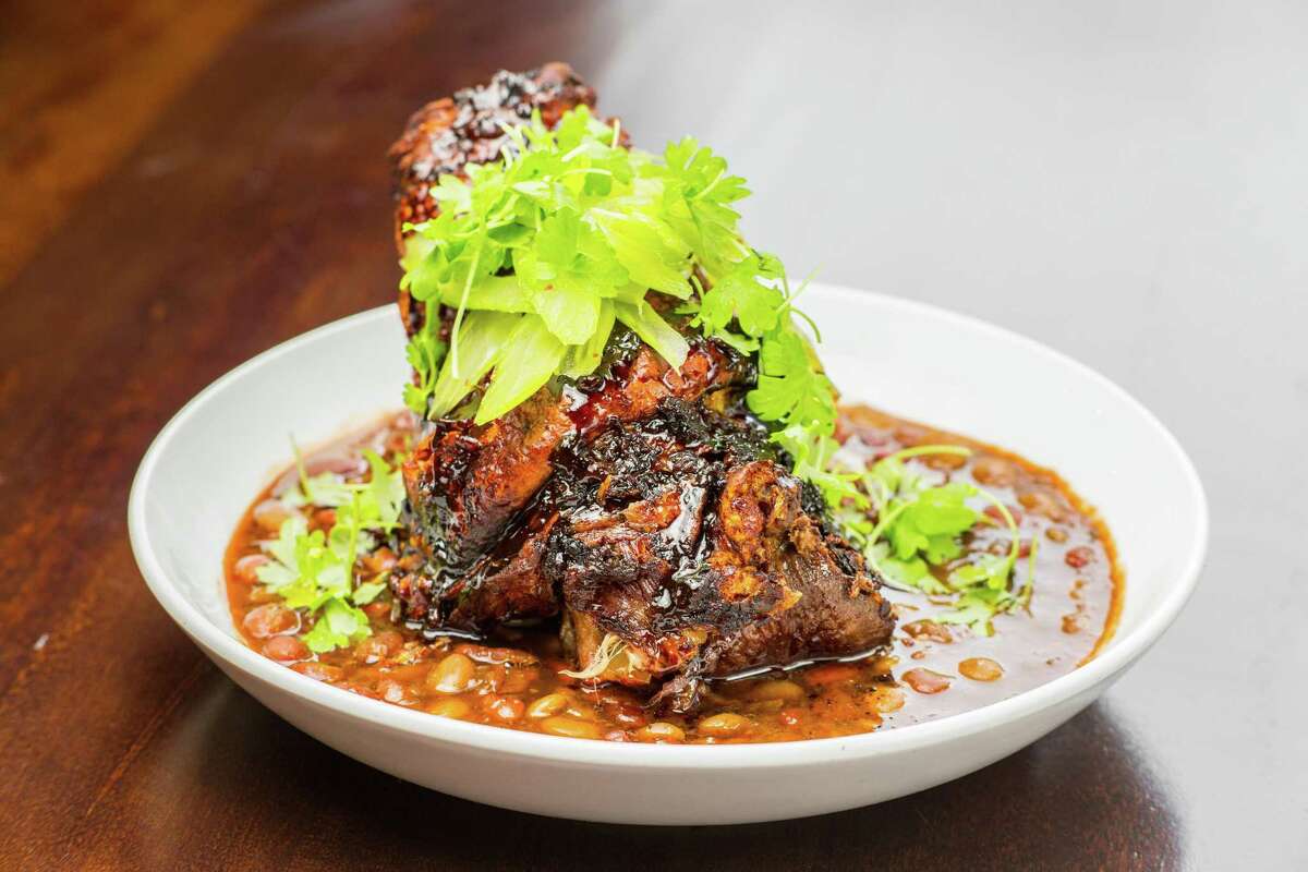 Crispy pork shank with braised seasonal beans and pickled celery at Kulture