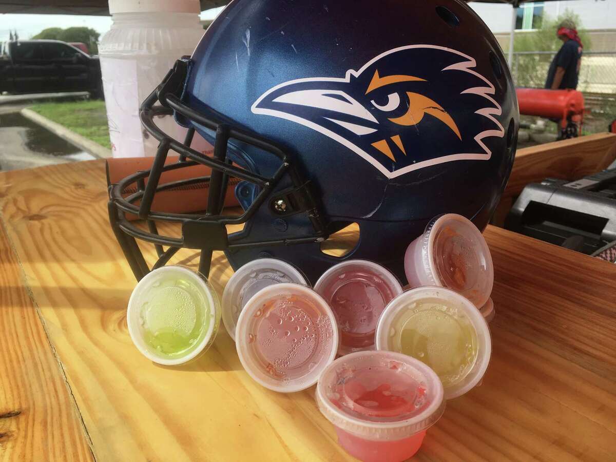 Liz Chavana of the Rowdy Road Grillers makes up an assortment of Jell-O shots before every UTSA home game.