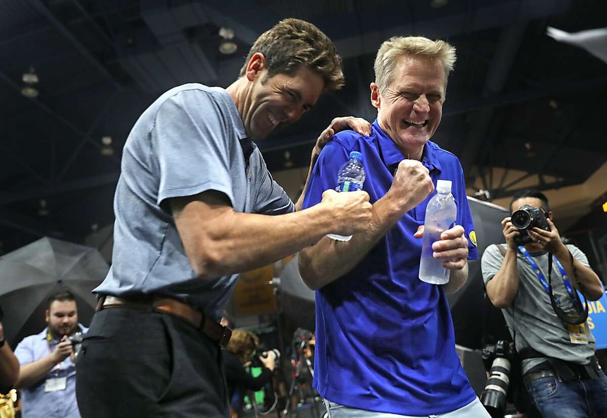 General manager Bob Myers and head coach Steve Kerr goof around during Golden State Warriors' Media Day in Oakland, Calif. on Monday, September 24, 2018.