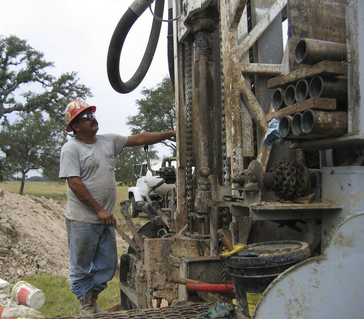 Efrain Gutierrez, 39, a driller from Hebbronville, operates a rig outside of Goliad, searchng for uranium deposits in the Goliad Aquifer in 2006. When uranium mining was active (as recently as 2011), the industry contributed enormously to the state economy, creating $311 million in annual economic output.