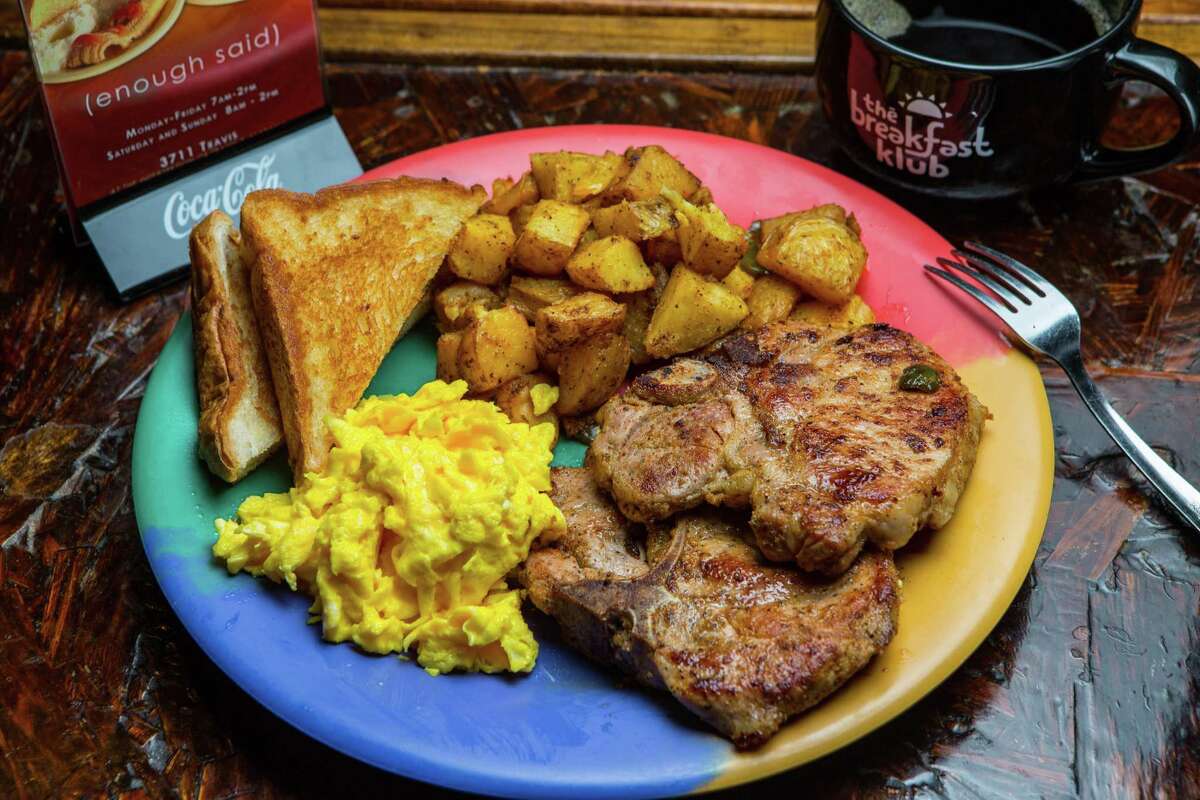 Grilled pork chops with scrambled eggs, potatoes and Texas toast at The Breakfast Klub