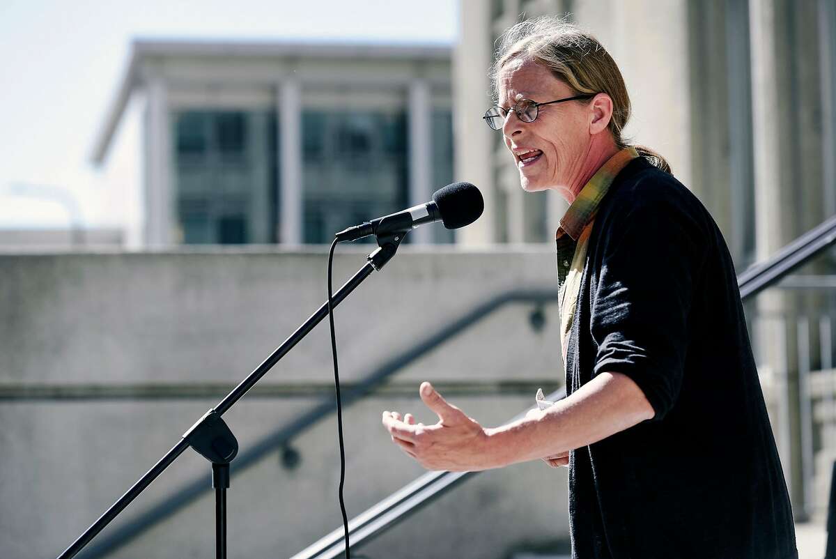 Andrea Prichett, founder of Cop Watch, speaks during a rally outside City Hall in Berkeley, Calif., on Monday September 24, 2018, organized by the National Lawyers Guild San Francisco Bay Area Chapter calling on Berkeley City Council to approve an anti-doxing policy at it's upcoming meeting.