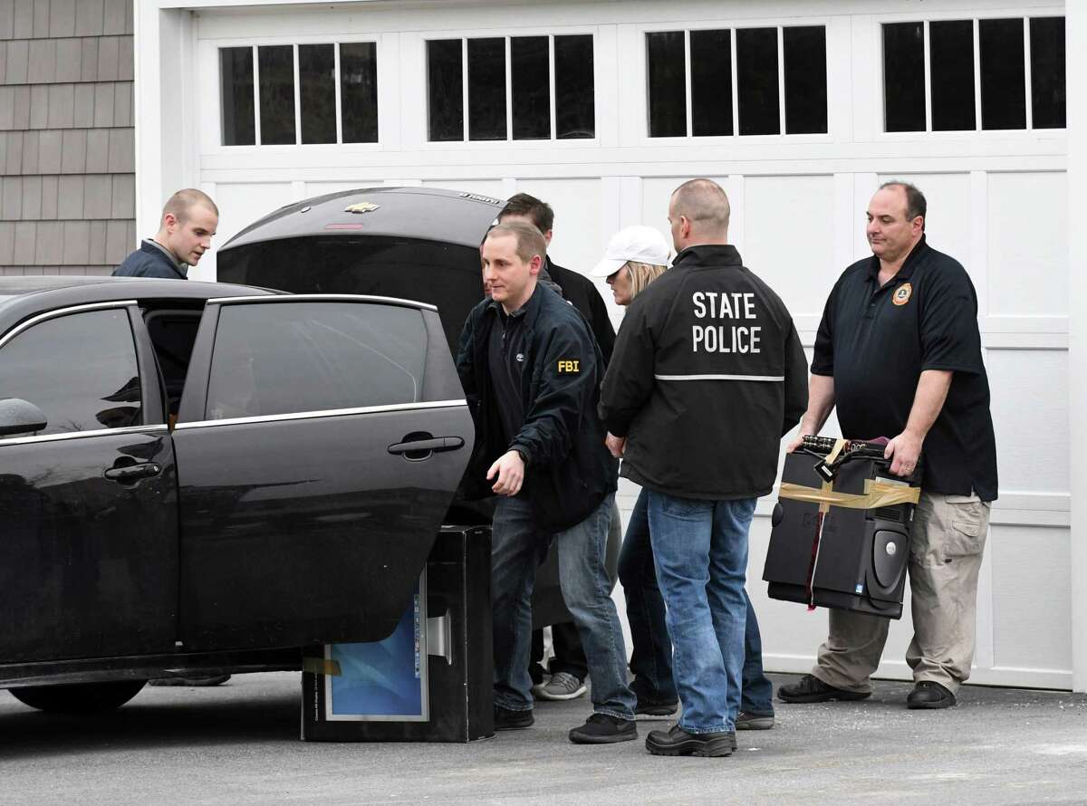 FBI and state police take computers and other evidence from the home of NXIVM co-founder Nancy Salzman which was raided by federal agents on Tuesday, March 27, 2018, in Halfmoon, N.Y. Keith Raniere, the co-founder of the NXIVM corporation has been arrested by the FBI based on a federal criminal complaint filed in the Eastern District of New York. (Will Waldron/Times Union)
