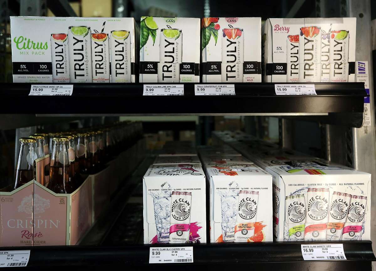White Claw Hard Seltzer and Truly Spiked & Sparkling are seen in a cooler at Binny's Beverage Depot on N. Marcey Street in Chicago on Wednesday, Sept. 19, 2018. (Terrence Antonio James/Chicago Tribune/TNS)