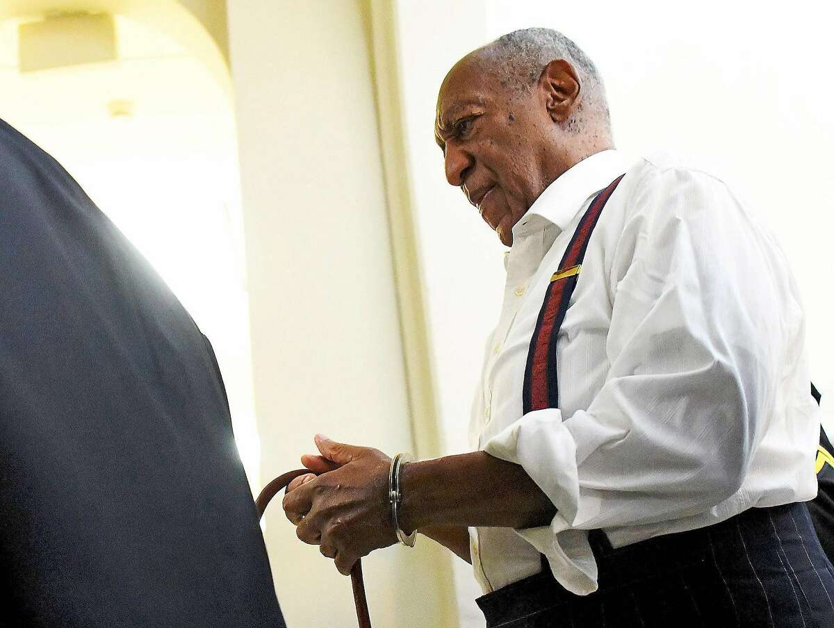 Bill Cosby leaves the courtroom in handcuffs after he he is given a three-to-10 year prison sentence on Tuesday, Sept. 25, 2018, at the Montgomery County Courthouse in Norristown, Pa. Cosby was sentenced for drugging and sexually assaulting a woman, Andrea Constand, at his home near Philaelphia 14 years ago. (Mark Makela/Pool via The New York Times) -- FOR EDITORIAL USE ONLY --