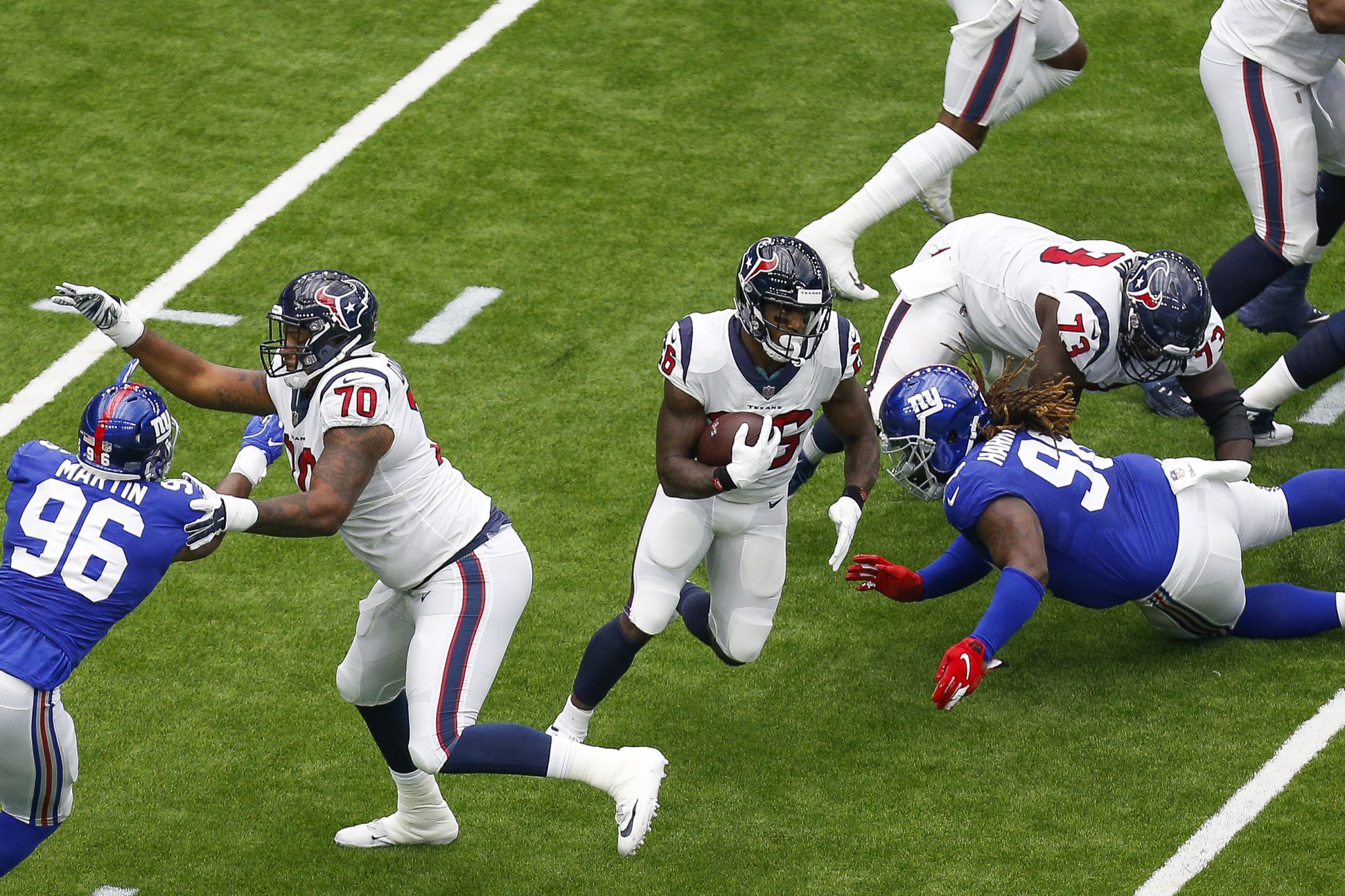 Houston Texans quarterback Deshaun Watson (4) breaks away from New York  Giants defensive end Kerry Wynn (72) during the first half of an NFL  football game Sunday, Sept. 23, 2018, in Houston. (