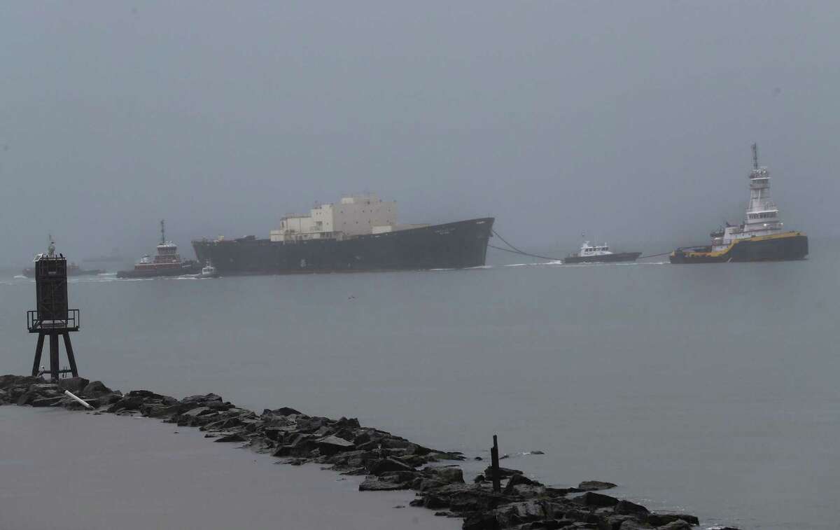 During a heavy rain shower the U.S. Army Corps of Engineers' STURGIS makes her way out of the Galveston shipping channel on her way to Brownsville Tuesday, Sept. 25, 2018, in Galveston.
