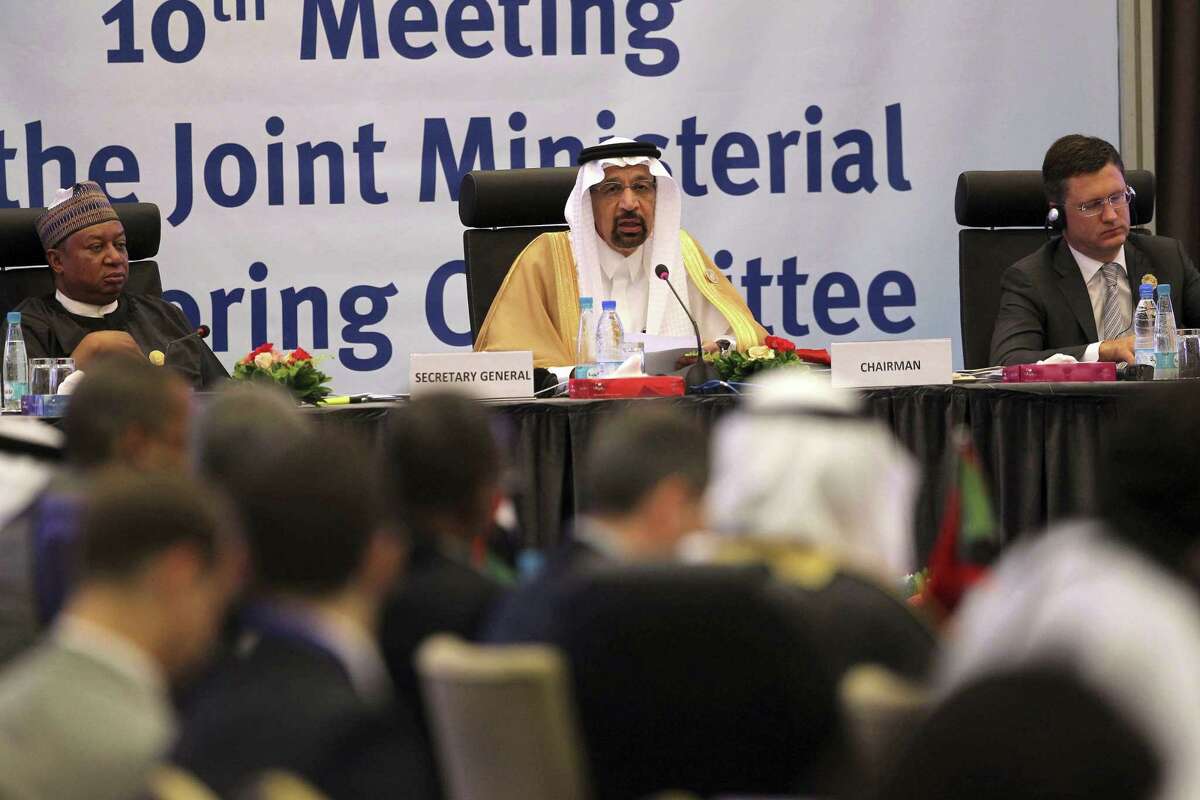 Khalid Al-Falih Minister of Energy, Industry and Mineral Resources of Saudi Arabia, center, speaks during OPEC's 10th meeting of the Joint Ministerial Committee to monitor the oil production reduction agreement of the Organization of the Petroleum Exporting Countries, OPEC, and non-OPEC members, in Algiers, Algeria, Sunday, Sept. 23, 2018. (AP Photo/Anis Belghoul)