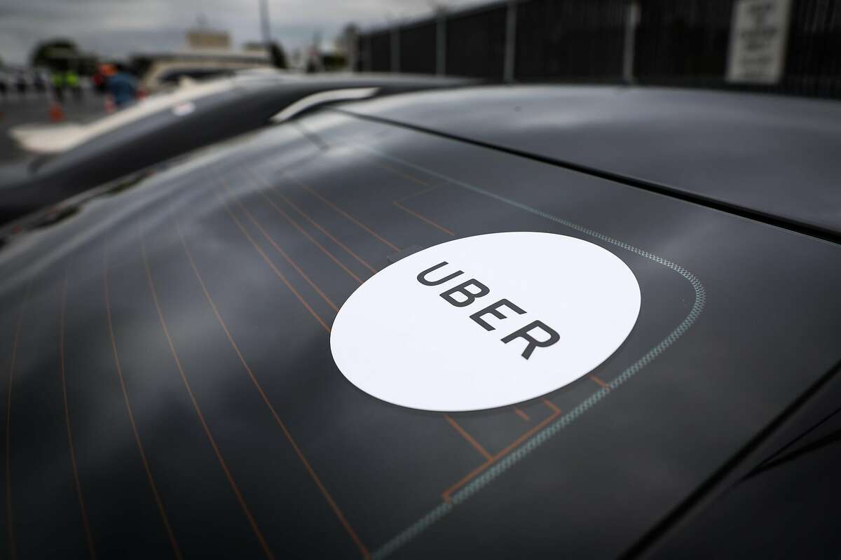 The decal on Uber driver Mustafa Ayubi's car is seen in the TNC parking lot #1 in Millbrae, California, on Tuesday, Aug. 14, 2018.