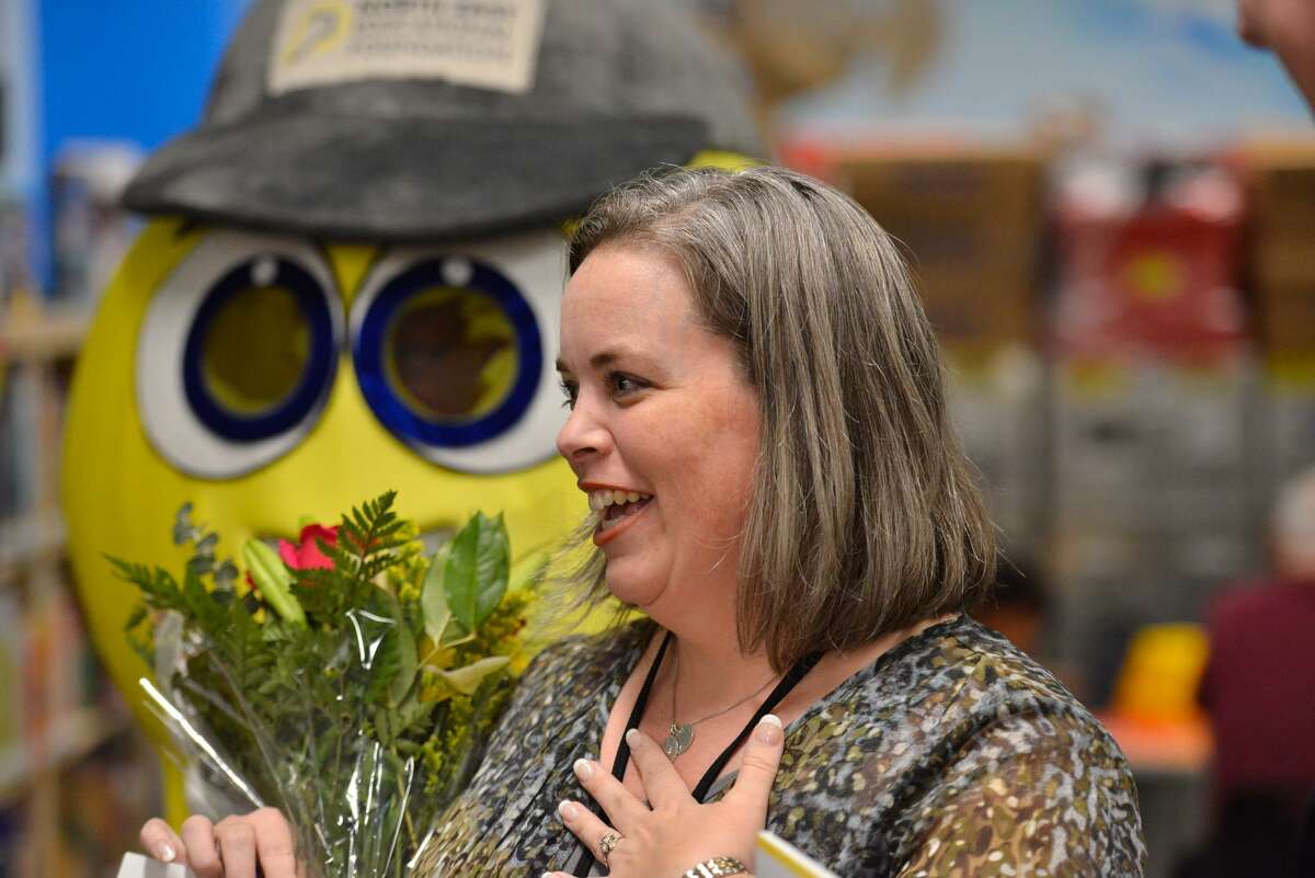 Oak Grove Elementary teacher Melissa Hardin reacts after she was awarded a check of $7,562 from the NEISD Education Foundation on Wednesday morning. The money will be used to purchase robotics, coding workshops and engineering shops.