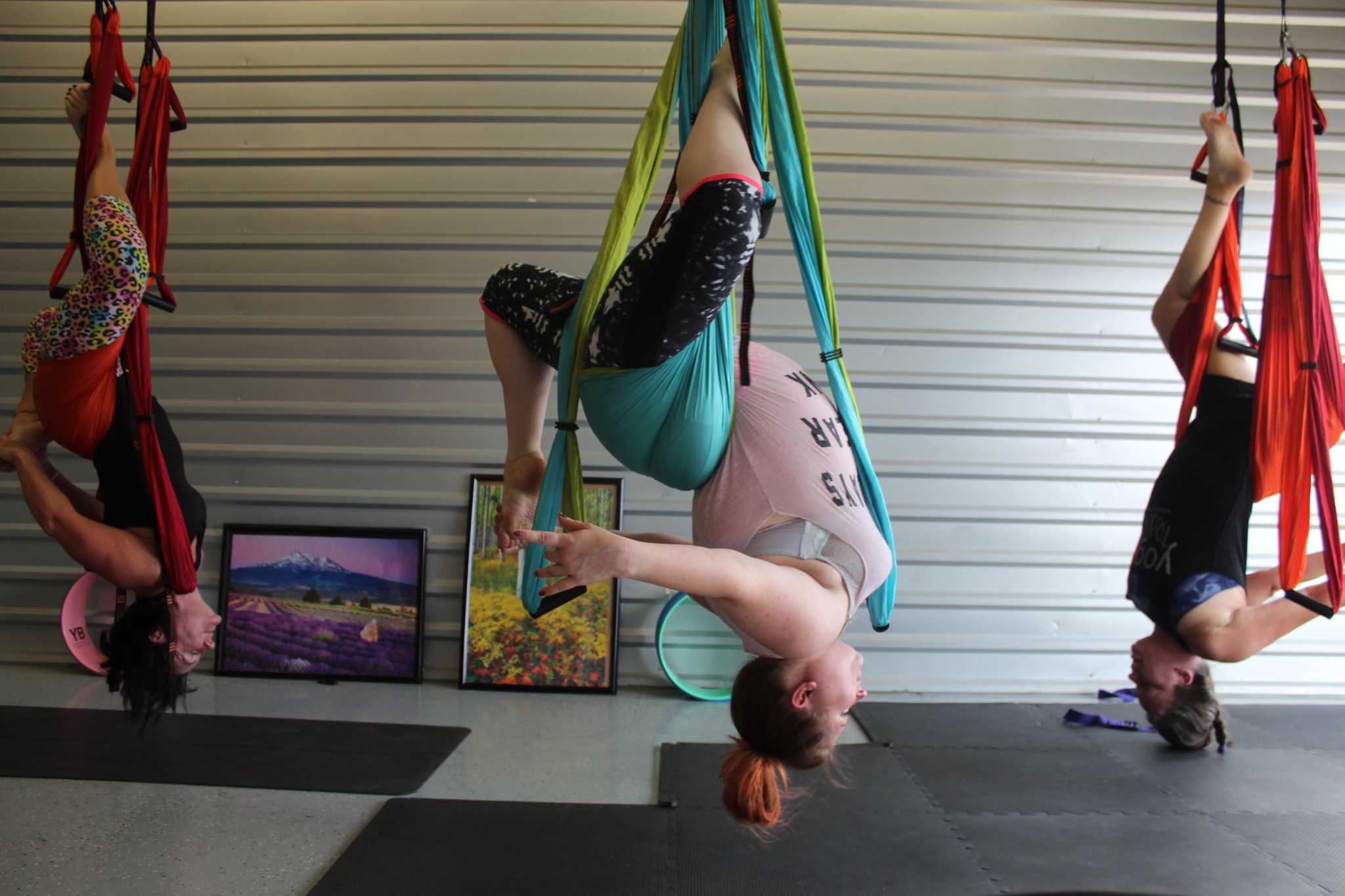 Yoga Trapeze studio in The Woodlands offers upside-down stretching, fun