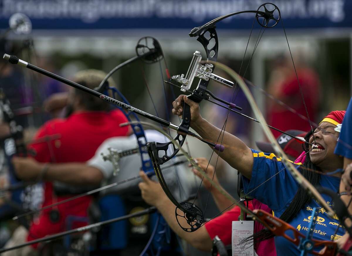 Babette Peyton of Chicago uses her teeth to draw her bow during a round of the archery competiton of the Valor Games Southwest held at Mission Concepcion Sports Park in San Antonio Wednesday, Sept. 26, 2018. "When you get messed up, you might have to do things differently, but you can do things," exlains Peyton.