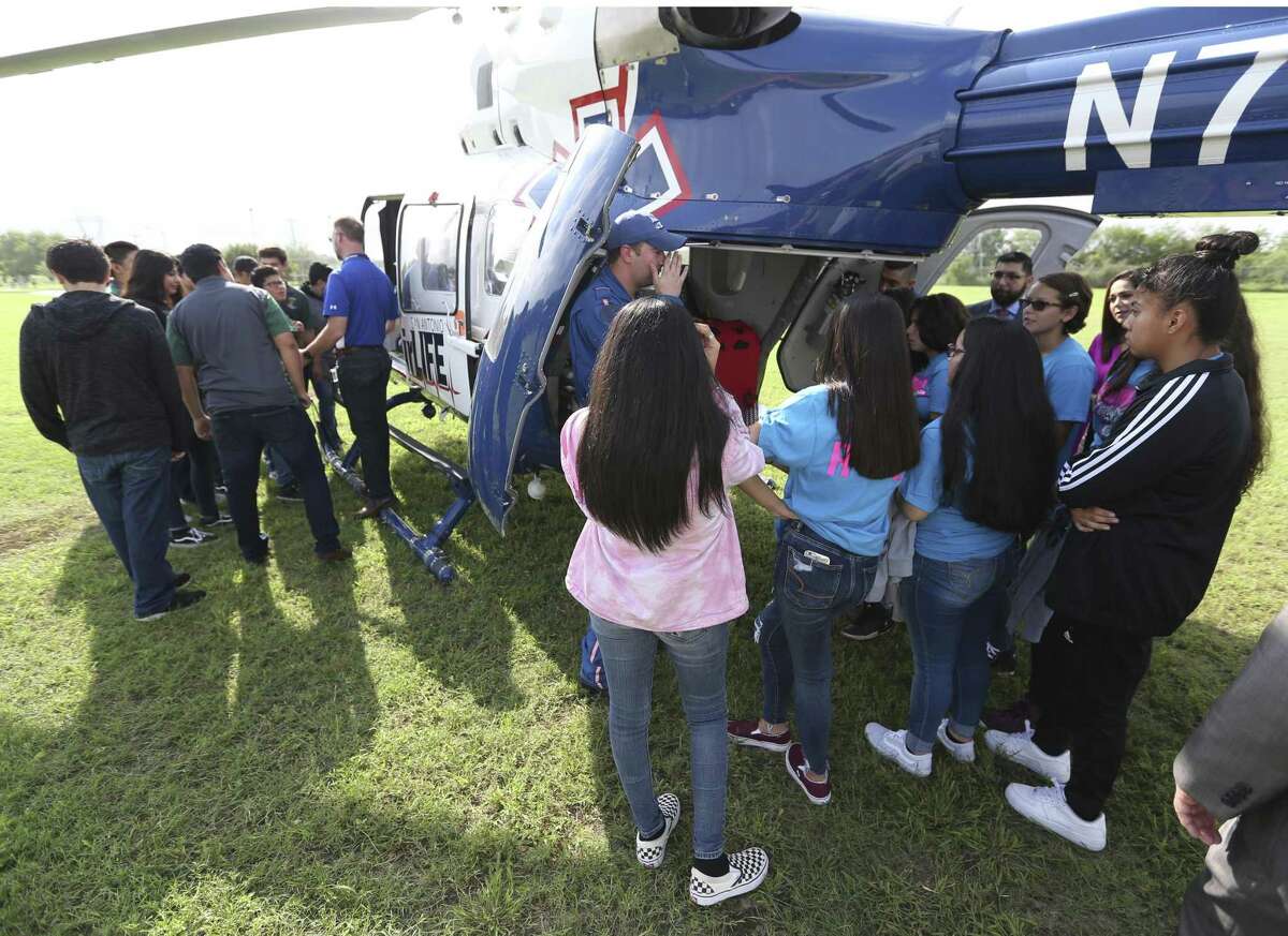 Southwest ISD high school, left, and middle school students tour Wednesday, Sept. 26, 2018 at Bob Hope Elementary School an AirLife helicopter after a press conference where the district announced the creation of a pre-k through 12th grade aeronautical program the district is starting.