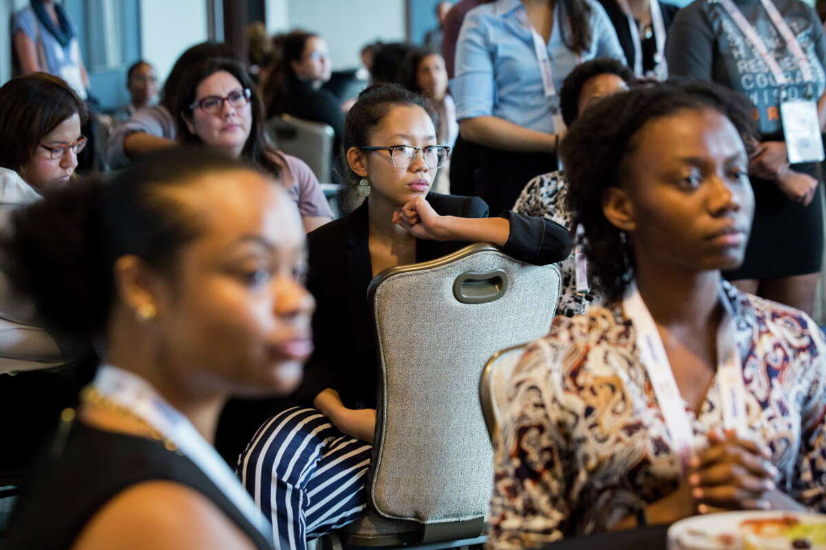 SMASH alumna Alicia Ngo listens to the presentation by SMASH Academy alumnae, Wednesday, Sept. 26, 2018, in Houston. SMASH is a STEM-intensive college preparatory program for underrepresented high school students of color free of cost.