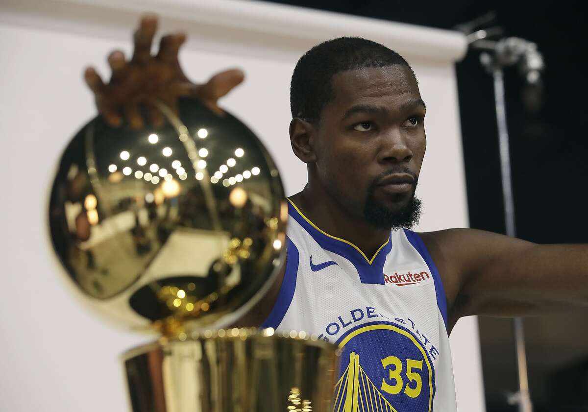 Golden State Warriors' Kevin Durant poses for photos during media day at the NBA basketball team's practice facility in Oakland, Calif., Monday, Sept. 24, 2018. (AP Photo/Jeff Chiu)