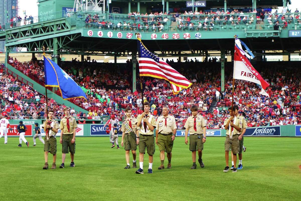 Seven members from Fairfield Boy Scout Troop 82 presented the American and Connecticut flags on the field during the national anthem before a nationally televised game at Fenway Park in Boston.