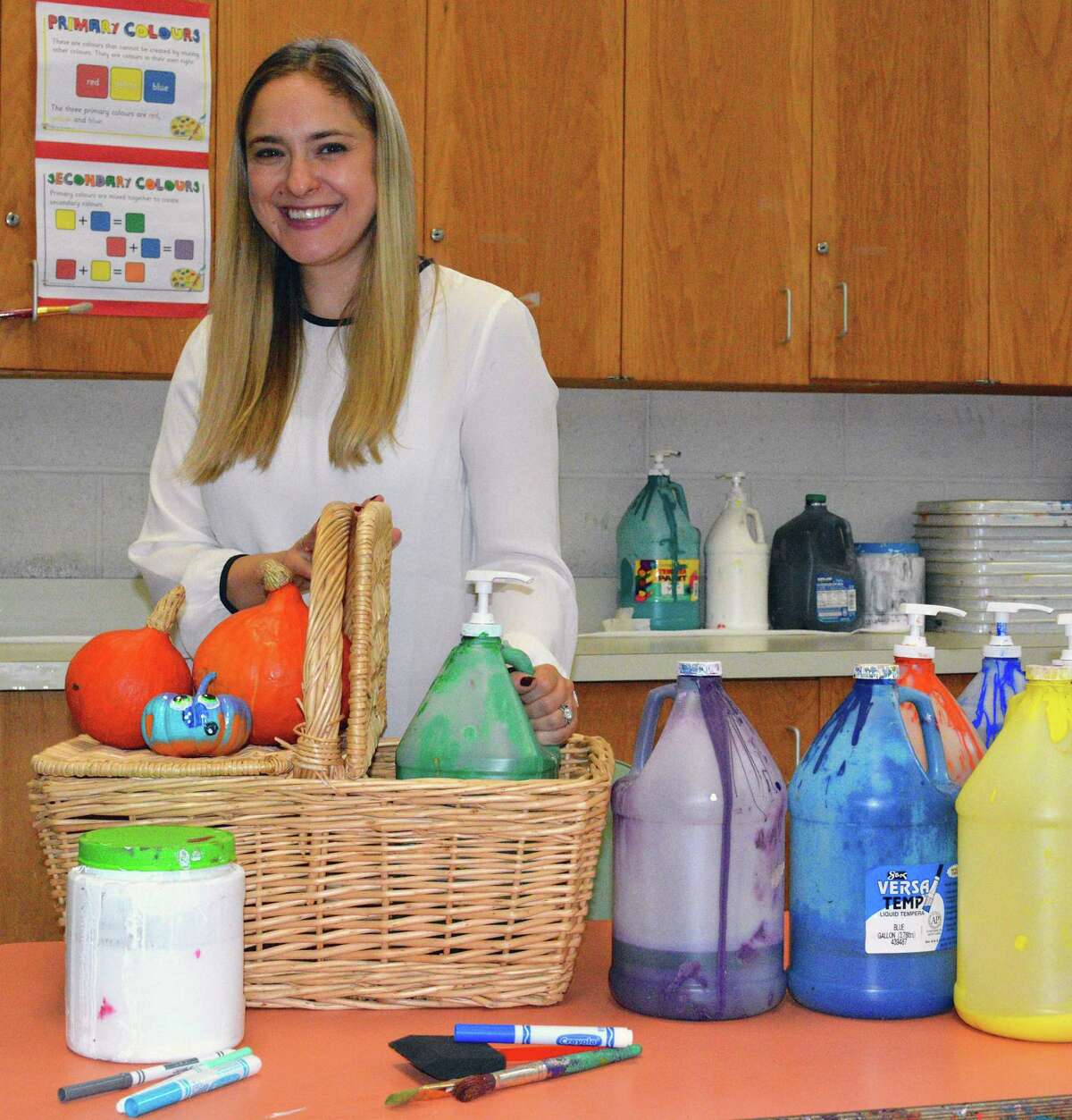 The Darien Arts Center is participating in the Darien Domestic Abuse Council and YWCA Family Fun Day at Hindley School on Sept. 29 from 1 to 4 p.m. Above, DAC Visual Arts Director Emily Altman prepares for the event, where the DAC will have a table for complimentary pumpkin painting and a caricaturist drawing free pictures from 1 to 3 p.m., with a drawing for a free full color caricature at 3 p.m. Net proceeds from Family Fun Day will support awareness, educationa, and prevention initiatives in Darien. Proceeds will also fund victim services provided by the Domestic Violence Crisis Center and the Center for Family Justice and a newly established fund called Wings of Hope. For more information about the DAC, visit darienarts.org or call 203-655-8683. The DAC is located at 2 Renshaw Road, behind Darien Town Hall.