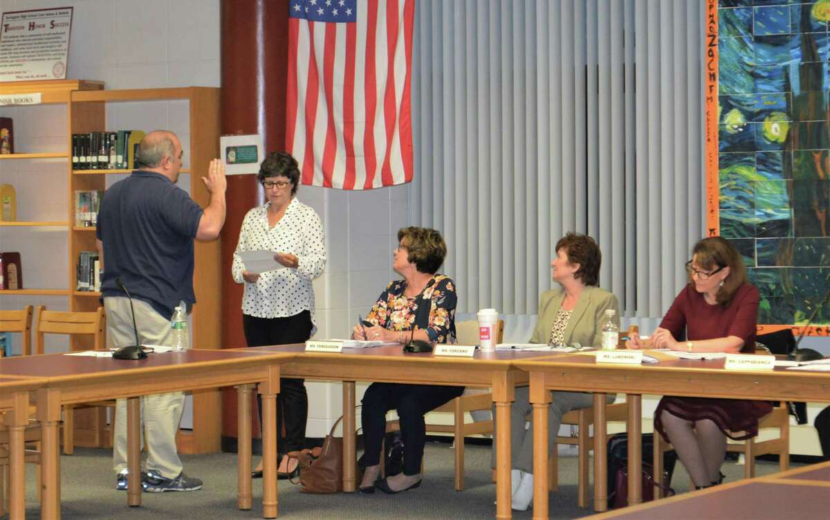 Gary Eucalitto is sworn in as a nominated Democratic member of the Board of Education on Wednesday.