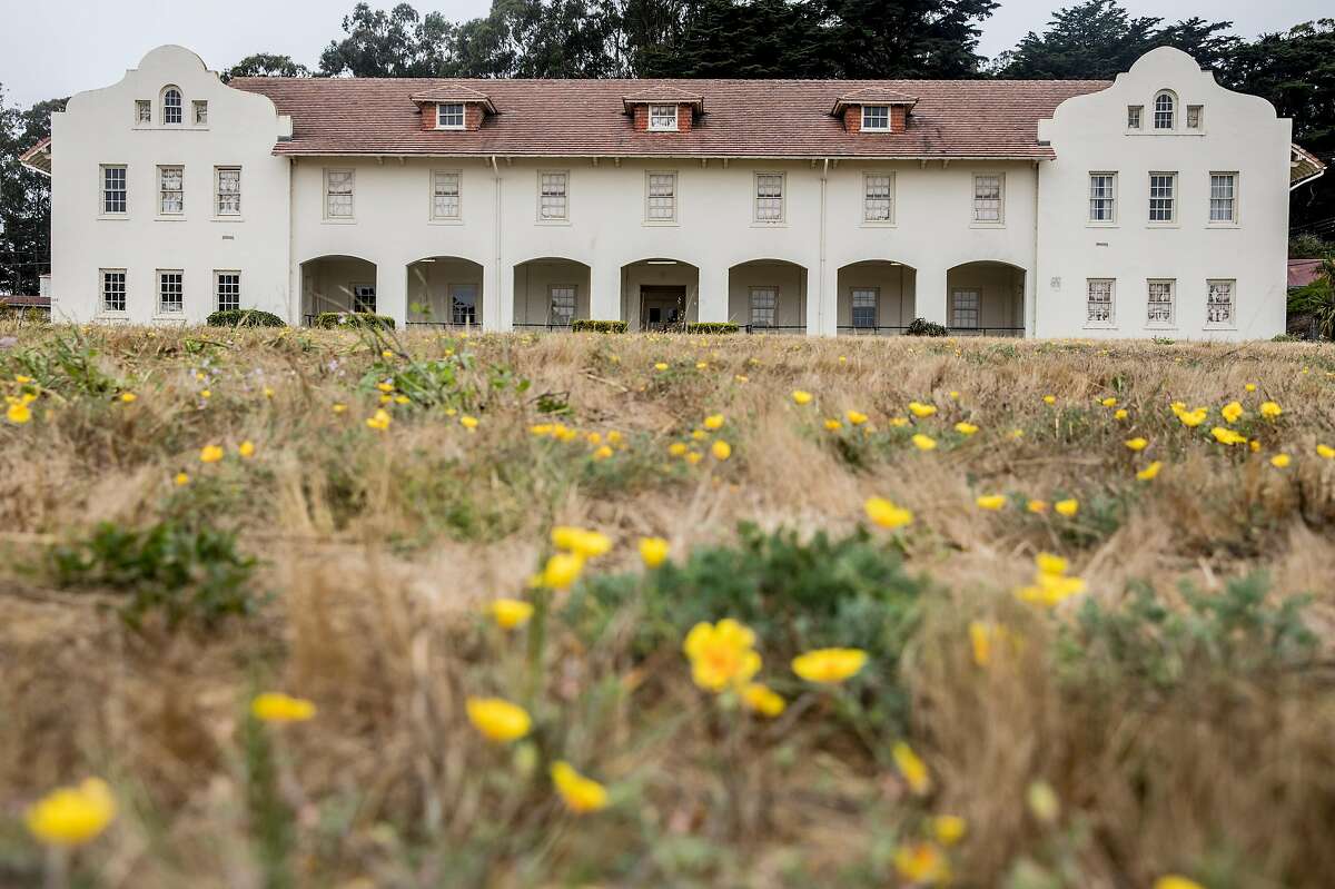 A large field sits between original barracks buildings at Fort Scott in the Presidio of San Francisco, Calif. Tuesday, July 17, 2018.